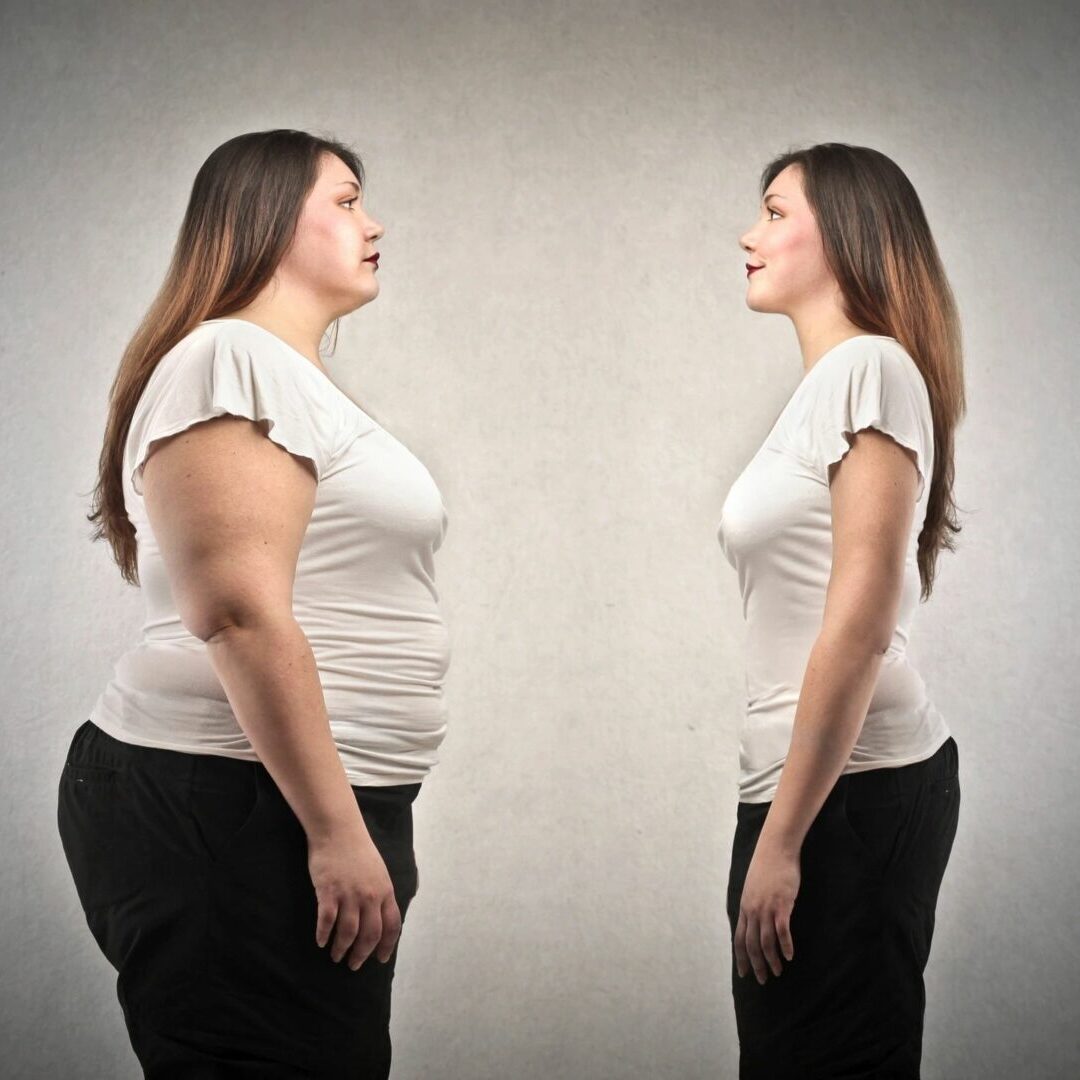 A woman is standing in front of another woman.